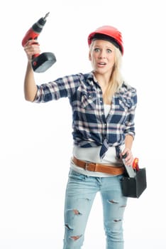 Female craftsman with cordless screwdriver and drill