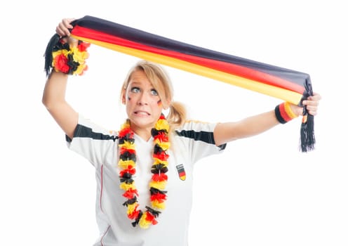 Blonde football fan holds up a fan scarf