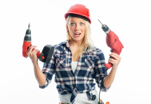 Female craftsman with cordless screwdriver and drill