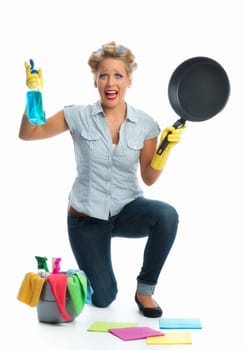 Stressed housewife cleans frying pan