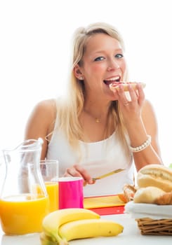 Blonde woman at the covered breakfast table