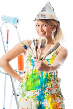 Female painter with different brushes