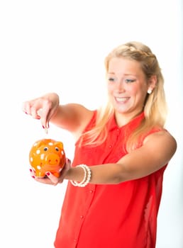 Blonde woman with piggy bank