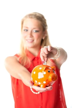 Blonde woman with piggy bank