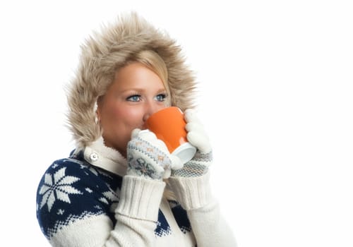 Blonde woman drinks from a mug