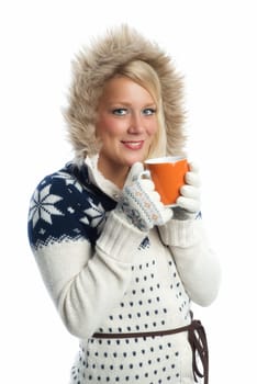Blonde woman drinks from a mug
