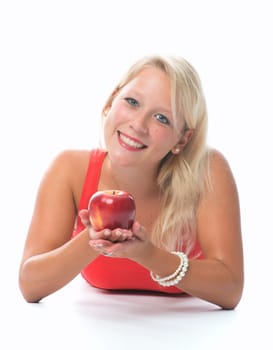 Blonde woman holds a red apple