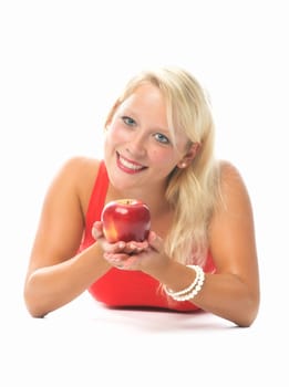 Blonde woman holds a red apple