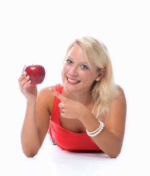 Blonde woman holds a red apple