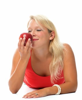 Blonde woman holds a red apple