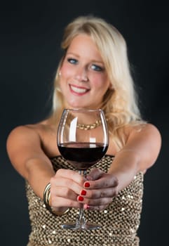 Elegant woman with red wine in glass