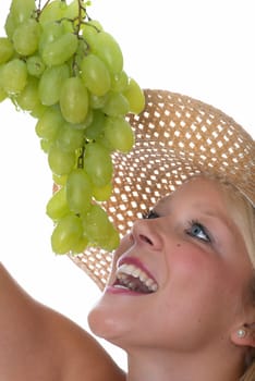 Blonde woman with grapes