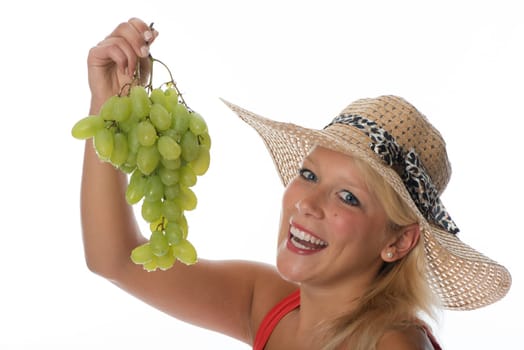 Blonde woman with grapes