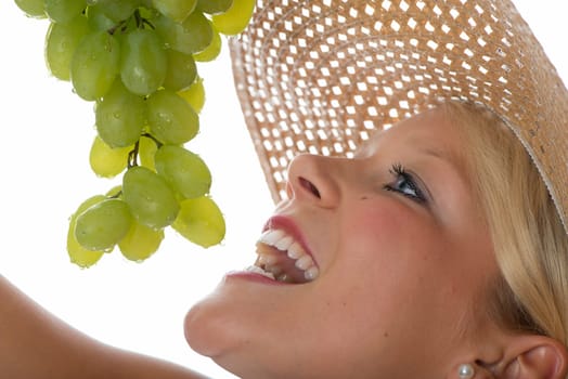 Blonde woman with grapes