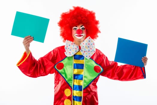 Clown holds cardboard cards