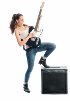 Young girl with electric guitar and amplifier
