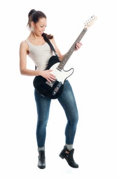 Young girl with electric guitar and amplifier