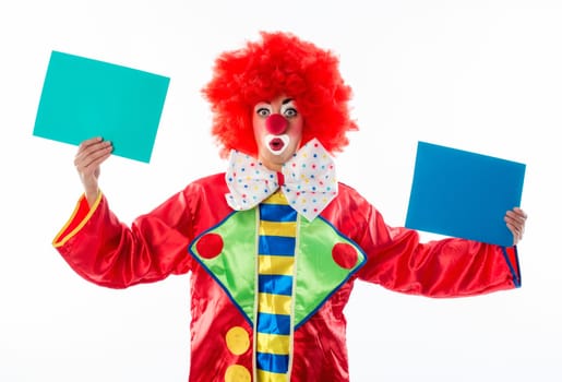 Clown holds up advertising signs