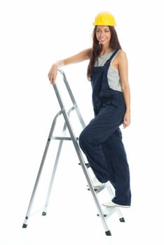 Female craftsman on step ladder