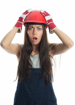 Female craftsman with construction helmet is horrified