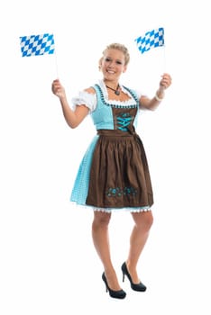 Bavarian girl waves with flags