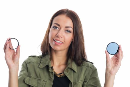 Photographer holds lens filter