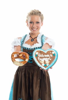 Bavarian girl with gingerbread heart and Brezn