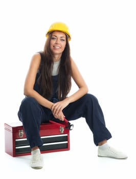 Female apprentice sits on toolbox