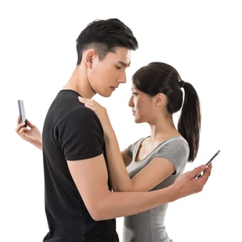 Busy couple hug and talk to others.