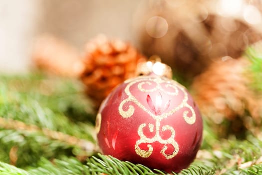 red Christmas tree ornament sembrightly decoration for Christmas with golden ornaments as macro detail