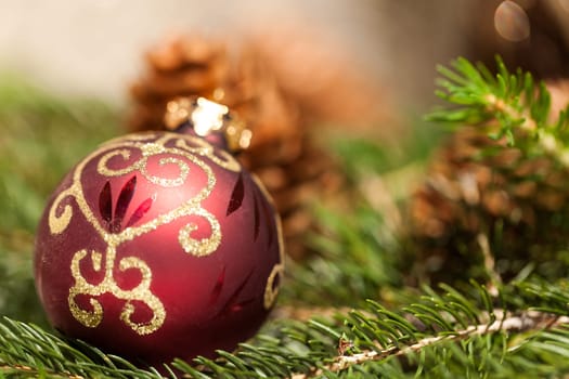 red Christmas tree ornament sembrightly decoration for Christmas with golden ornaments as macro detail