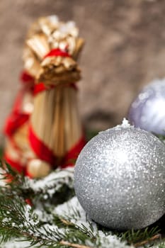Silver Christmas bauble jewelry with deer and fir branches decoration for Christmas as macro detail