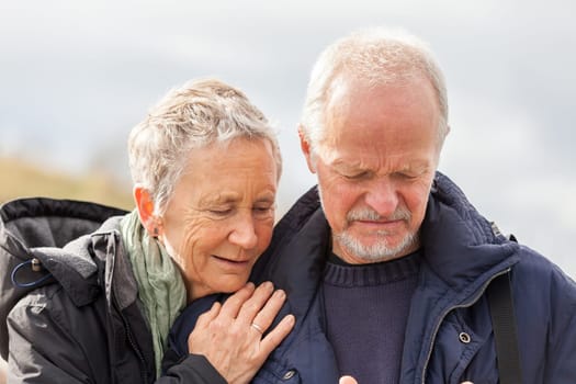 older adult happy couple walks on the beach in autumn lifestyle happiness