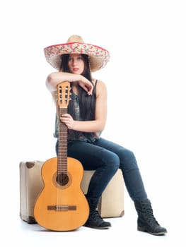 Girl with suitcase and guitar