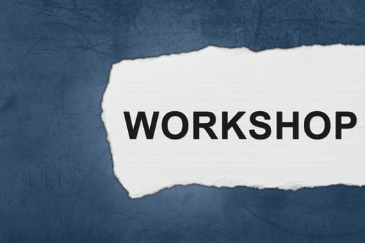 workshop with white paper tears on blue texture