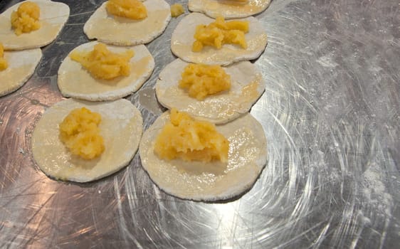 Corn tortillas filled with pineapple ready to prepare over griddle