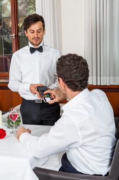 Young couple group in a restaurant cheerful while drinking