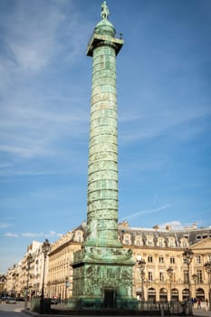 Exterior view of a Parisian townhouse in summer in front of a blue sky