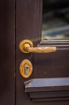 Doorknob doorknob on a wooden door entrance at a house as a close-up