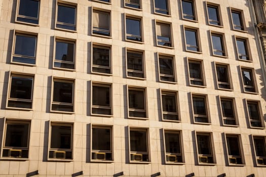 Exterior view of a Parisian townhouse in summer in front of a blue sky