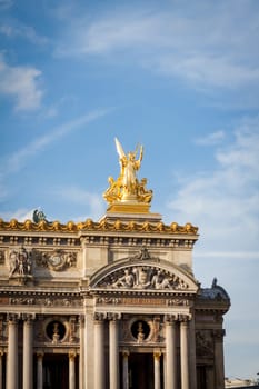 Exterior view of a Parisian townhouse in summer in front of a blue sky