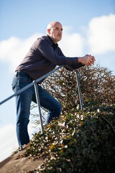 Man middle-aged senior pensioner taking a break in the outdoor park