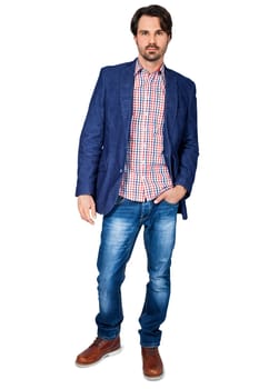 Young man in trendy casual look with dark hair and beard isolated against a white background