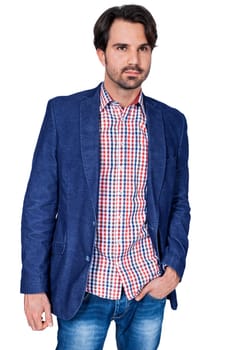 Young man in trendy casual look with dark hair and beard isolated against a white background