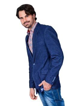 Young man in trendy casual look with dark hair and beard isolated against a white background