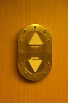 elevator,elevator,button,switch,up,down,up,down,brown,wood,wall,shield,metal,ring