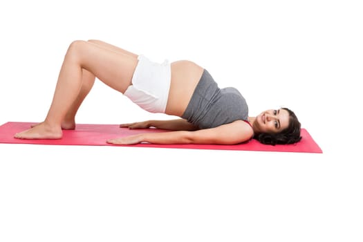 Young woman at birth preparation yoga isolated against white background