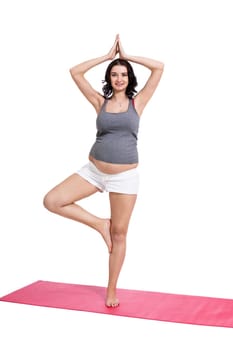 Young attractive mother in swing at training isolated against white background