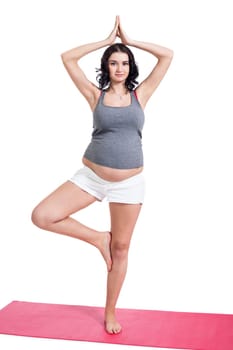 Young attractive mother in swing at training isolated against white background