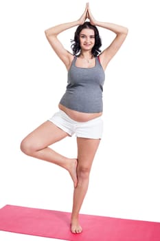 Young attractive mother in swing at training isolated against white background